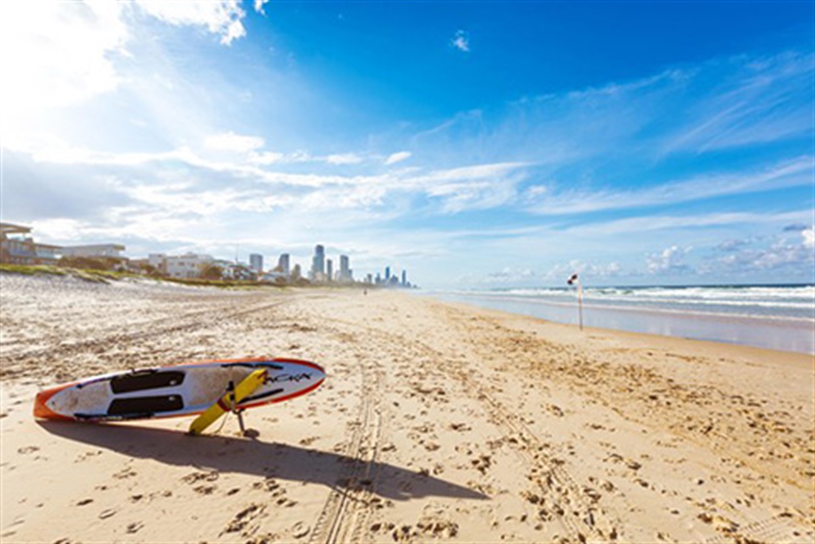 Wide quiet Mermaid Beach sand near Broadbeach with the Gold Coast skyline in the distance